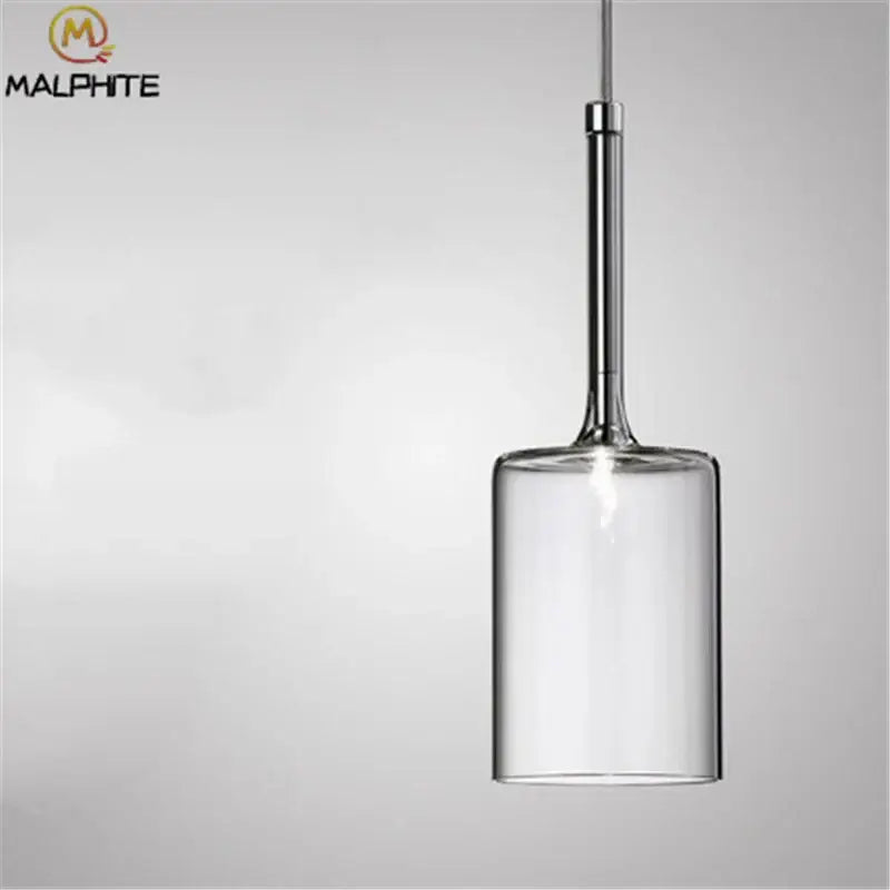 Modern chrome glass bottle pendant light with clear cylindrical glass and chrome stem by Malphite for dining room decorbites glass bottle pendant