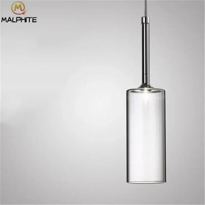 Modern chrome glass bottle pendant light featuring a clear glass bottle pendant with a chrome-finished metal rod for dining room decorbites
