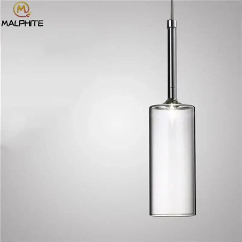 Modern chrome glass bottle pendant light featuring a clear glass bottle pendant with a chrome-finished metal rod for dining room decorbites