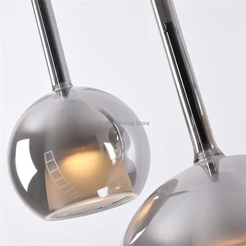 Modern chrome glass bubble pendant lights with spherical design and minimalist chrome finish for dining room decorbites chandelier