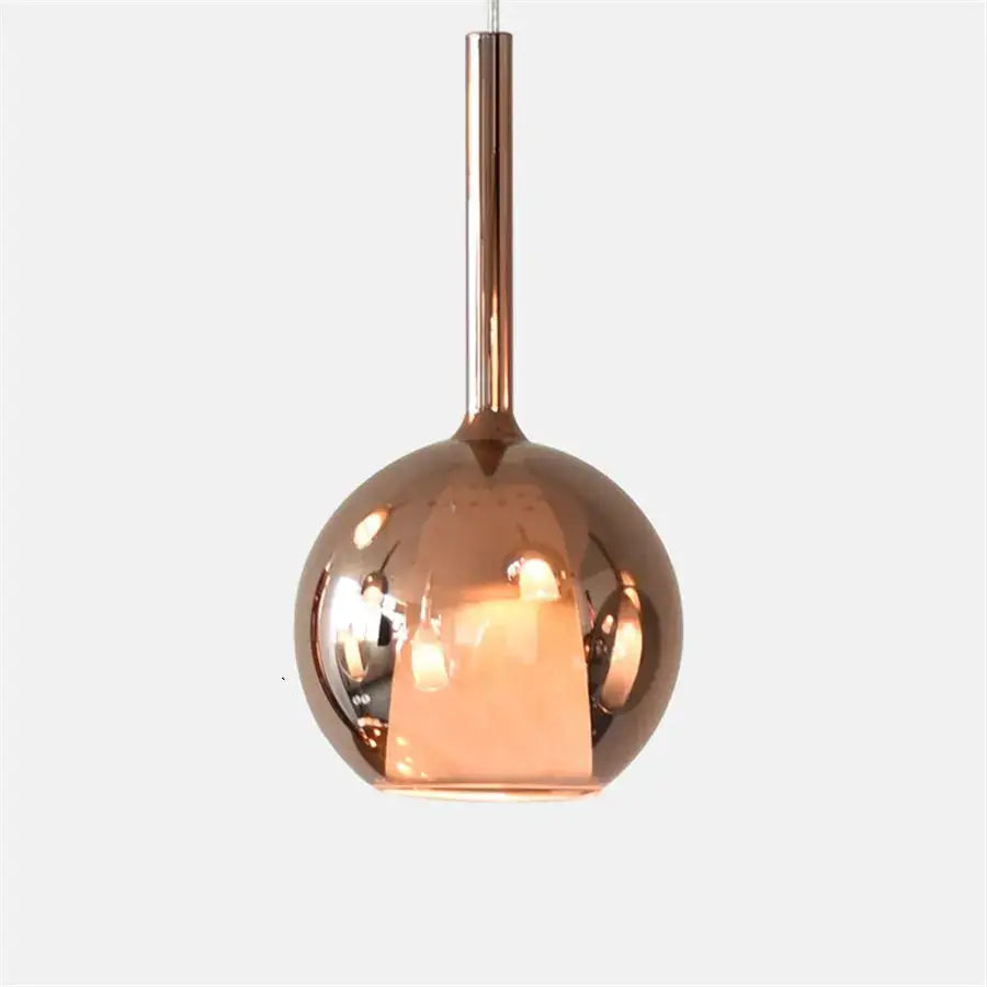 Modern chrome glass bubble pendant lights featuring a copper-finished glass bubble pendant with a polished metal stem