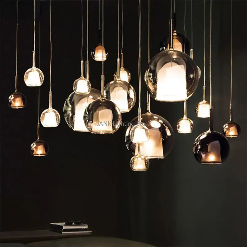 Modern chrome glass bubble pendant lights featuring clear frosted and dark metallic finishes for dining room decorbites glass bubble pendant