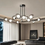 Modern chrome glass globe chandelier with clear glass globe bulbs in a branching design for dining room lighting