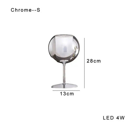 Modern chrome glass gold table lamp with sleek reflective surface and slender stem for luxury living room decorbites glass gold