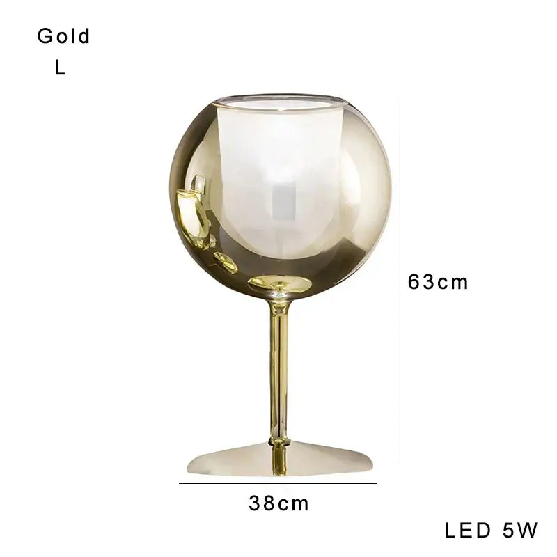 Modern chrome glass gold table lamp with a gold-colored spherical design and slender stem for luxury living room decorbites