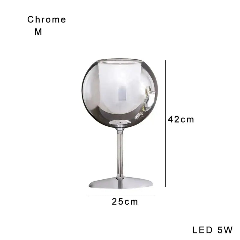 Modern chrome glass gold table lamp with a sleek reflective surface and slender stem for luxury living room decorbites glass gold
