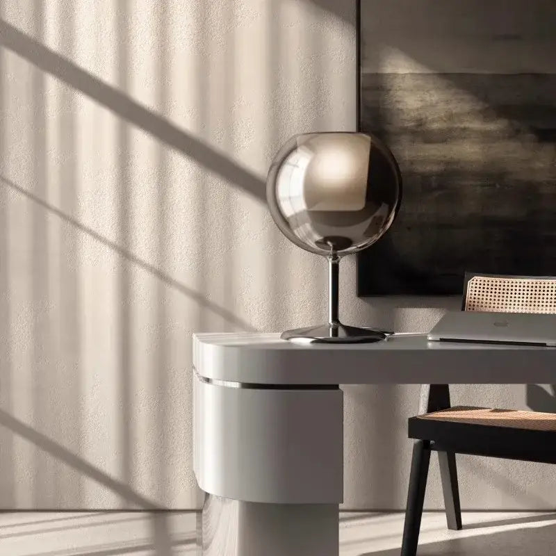 A sleek spherical chrome table lamp with minimalist glass gold design for luxury living room decorbites glass gold table