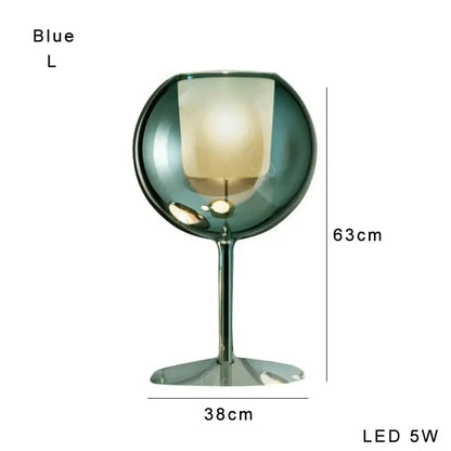 Modern chrome glass gold table lamp with translucent blue globe and slender metallic stem for luxury living room decorbites glass gold