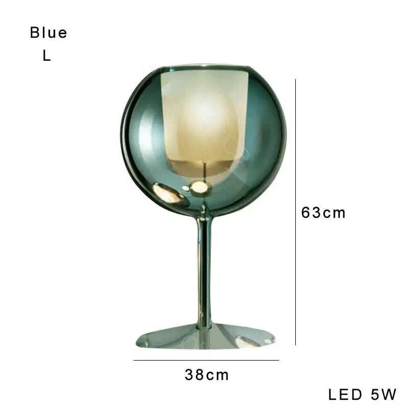 Modern chrome glass gold table lamp with translucent blue globe and slender metallic stem for luxury living room decorbites glass gold