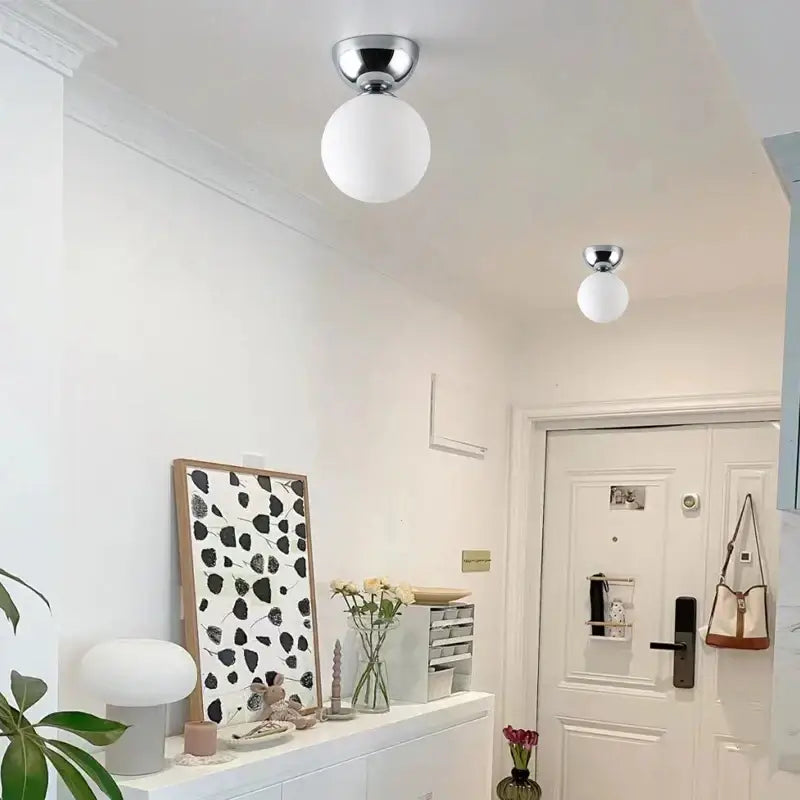 Two modern chrome glass iron led ceiling lights with frosted white spherical shades for bedroom decorbites glass iron