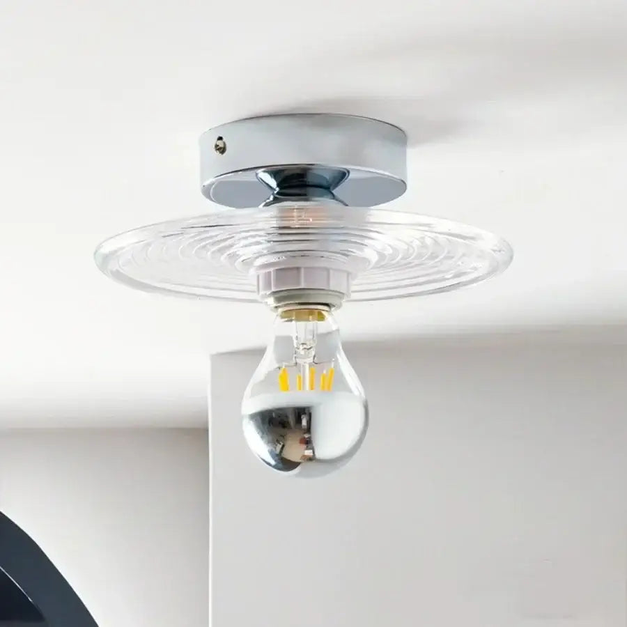 Modern chrome ceiling light with clear ripple-patterned glass led shade designed for bedroom use
