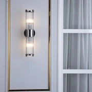 Modern chrome glass rod wall sconce with vertical rods and minimalist design for bathroom vanity lights