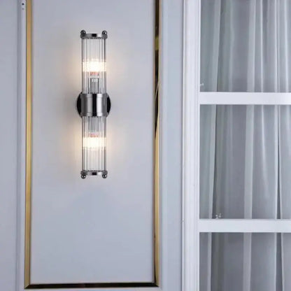 Modern chrome glass rod wall sconce with vertical rods and minimalist design for bathroom vanity lights