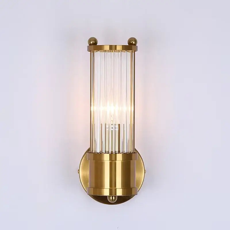 Gold-finished rod wall sconce with vertical glass rods and spherical accents for modern bathroom vanity lights
