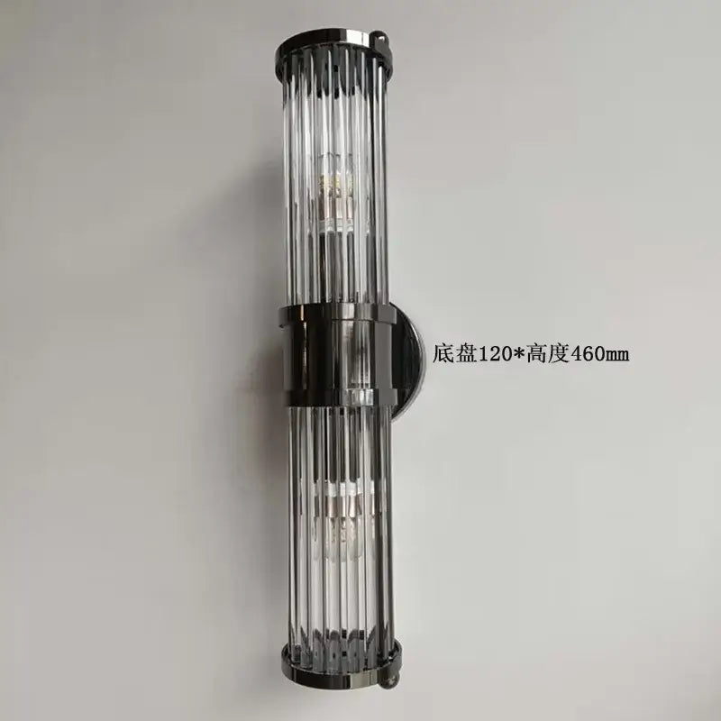 Modern chrome glass rod wall sconce with sleek black metal frame and clear vertical rods ideal for vanity lights