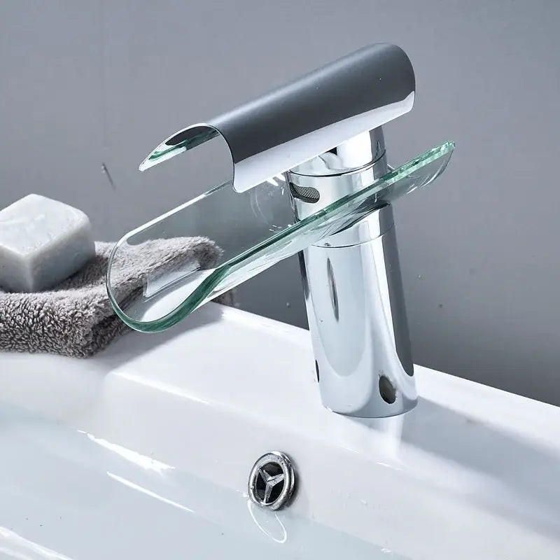 Modern chrome basin faucet with sleek curved glass spout and handle for bathroom glass spout basin waterfall design