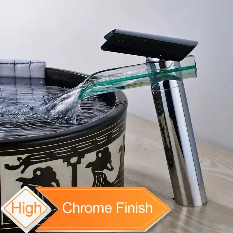 Modern chrome basin faucet with sleek black glass spout and transparent waterfall design for bathroom use
