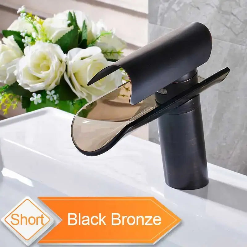 Black bronze short waterfall basin faucet with sleek glass spout and polished metallic finish for modern bathroom use