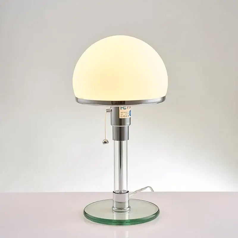 Modern chrome glass table lamp with a frosted opal dome shade and clear glass circular base for elegant decorbites glass table lighting