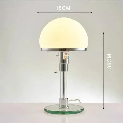 A sleek modern chrome glass table lamp with a frosted white dome shade for stylish bedroom decorbites glass table lighting