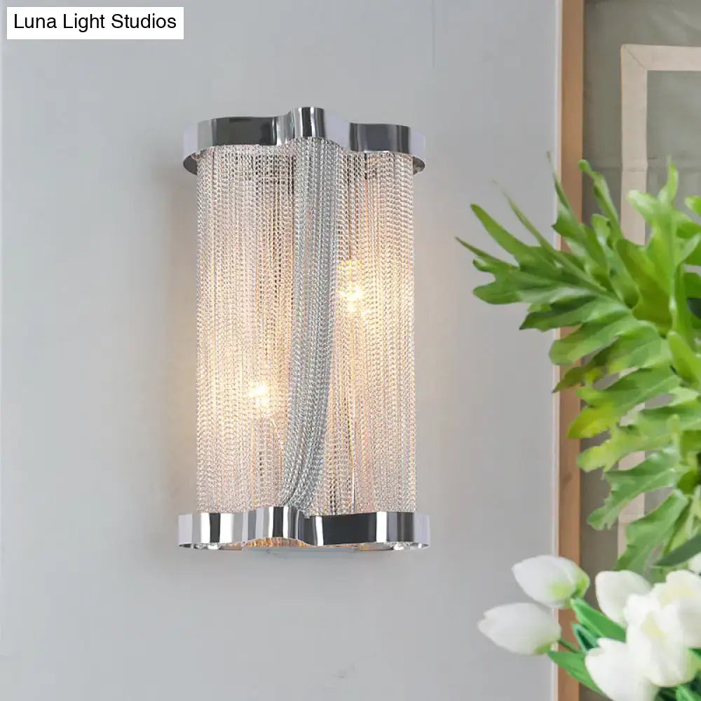 Modern chrome wall lamp with cascading silver chain detailing and gold crystal tassel for bedroom use set of 2