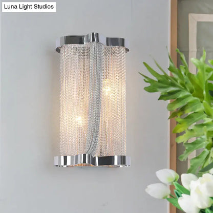 Modern chrome wall lamp with cascading silver chain detailing and gold crystal tassel for bedroom use set of 2