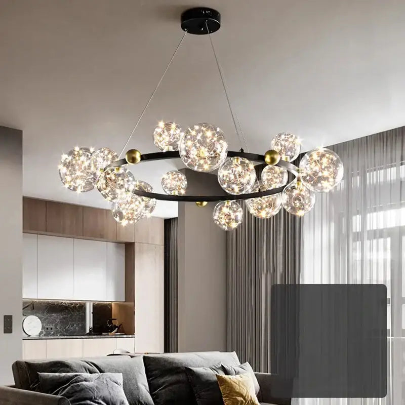 Modern black metal decorbites crystal chandelier with clear glass spheres, warm led lights, and gold-toned accents for living room