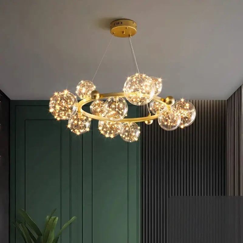 Modern chrome and gold decorbites crystal chandelier with clear glass spheres and warm led lights for living room use