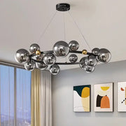 Modern chrome and gold decorbites crystal chandelier with sleek black frame for elegant living room lighting