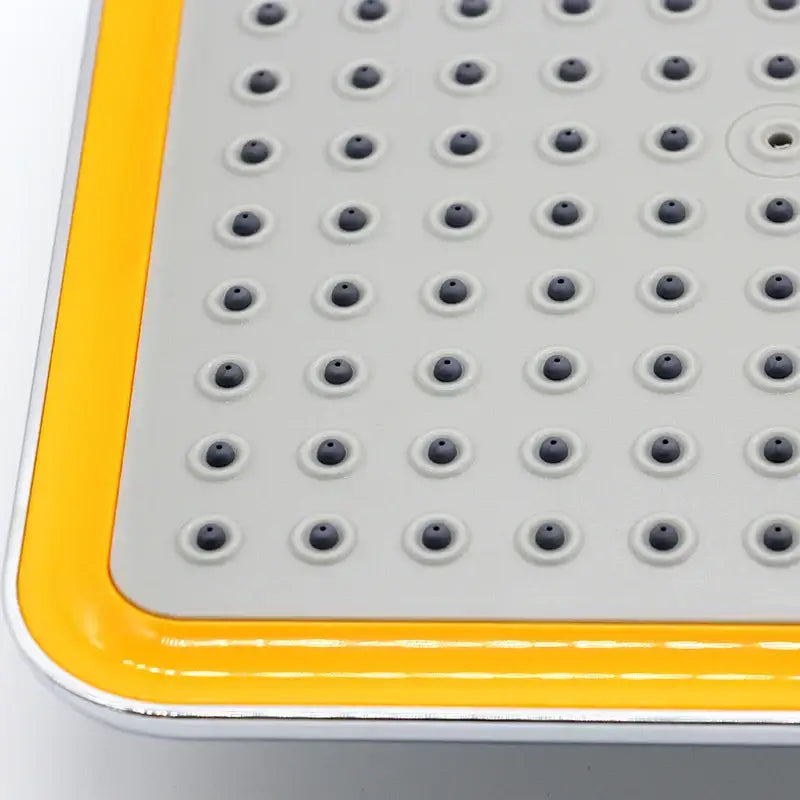 Gray and yellow silicone shower mat with black circular grips complements modern chrome and gold decorbites 20cm square rainfall shower head bathroom