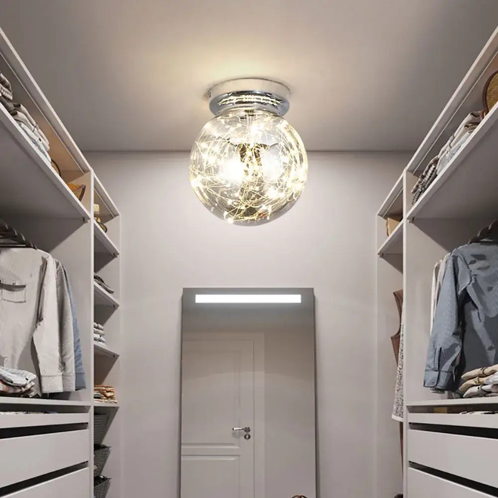 Modern chrome gypsophila led ceiling light with clear glass globe and glowing fairy lights for bedroom decor