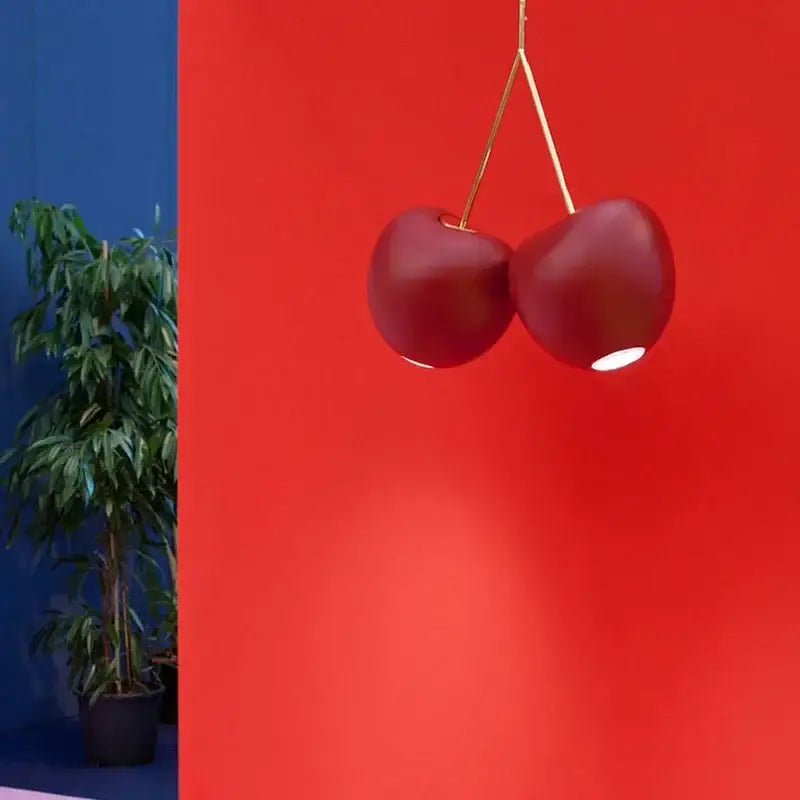 Modern chrome heart creative light chandelier featuring a sleek red cherry creative light pendant with gold stems