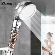 Modern chrome high pressure anion shower head with stop button and transparent filter housing filled with multicolored beads by zhang ji