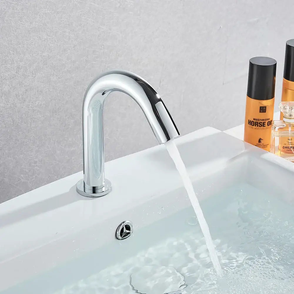 Modern chrome infrared sensor faucet with single-handle and sleek curved spout for touchless bathroom basin mixer