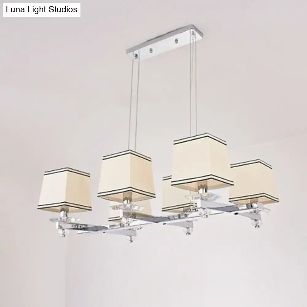 Modern chrome island pendant light with four cream fabric shades and black trim ideal for dining rooms pendant light kit