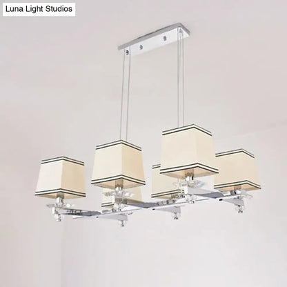 Modern chrome island pendant light with four cream fabric shades and black trim ideal for dining rooms pendant light kit