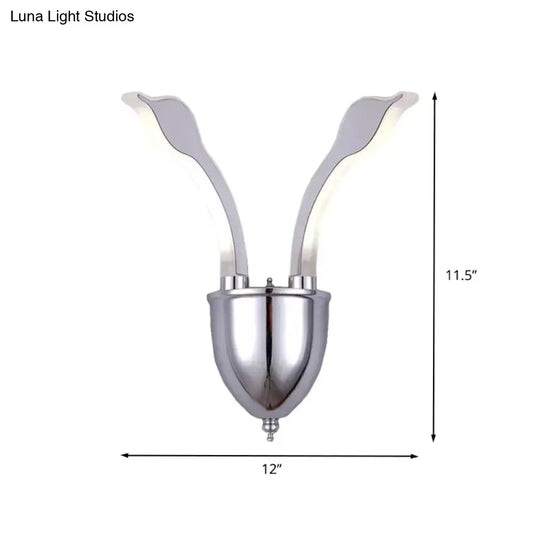 Modern chrome leaf led wall sconce with two warm white light acrylic shade arms extending upward from a rounded base