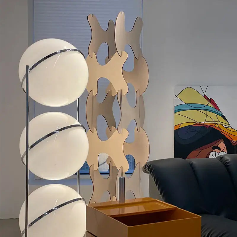 Modern chrome led floor lamp with three white globe shades on a sleek garrault led chrome stand for living room decor