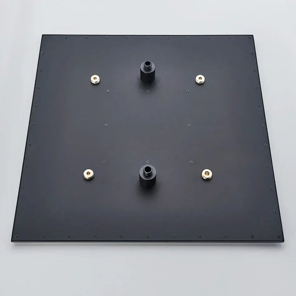 Back side of modern chrome rain shower head with black square mounting plate and gold-colored nuts for ceiling sprayer installation