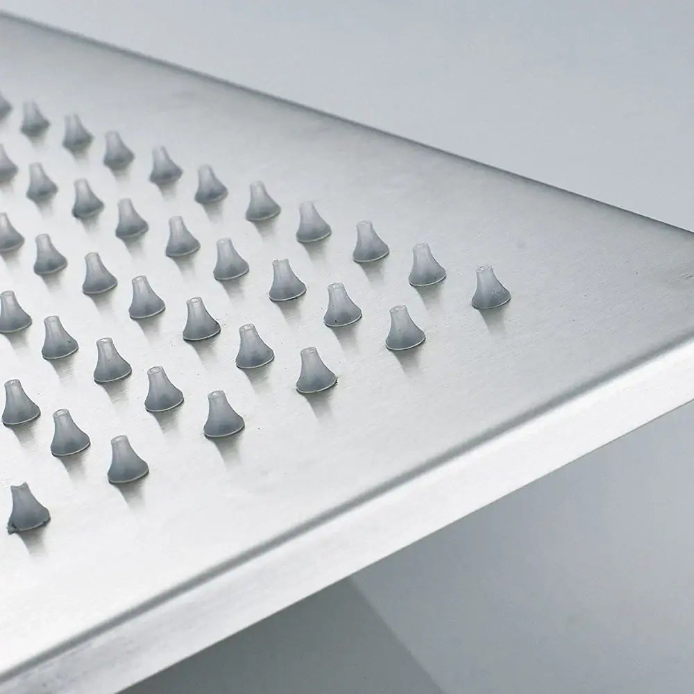 Silver stainless steel rainfall shower head with conical rubber nozzles and color changing LED lights for bathroom use