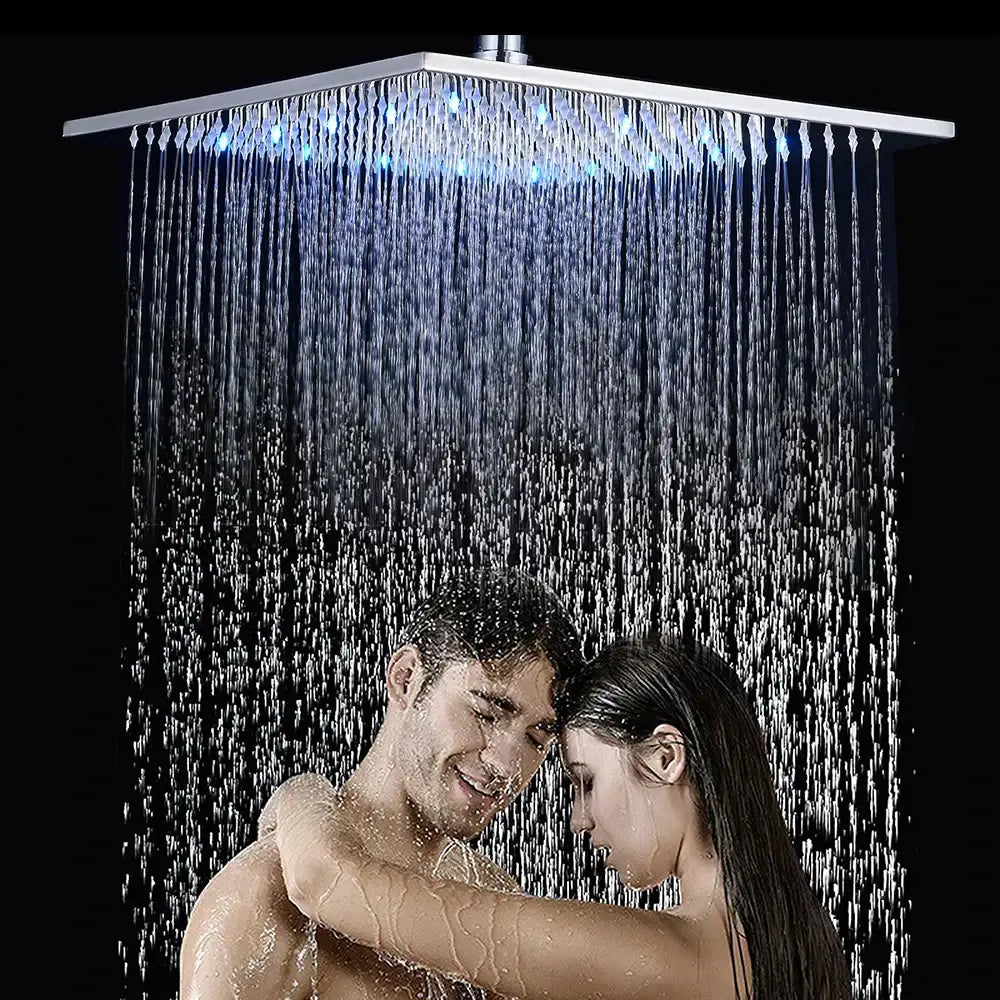 Modern chrome rainfall shower head with square chrome finish and blue led lighting multiple water streams