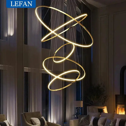 Modern gold-toned pendant light with interlocking circular rings and led bulbs for living room square meters