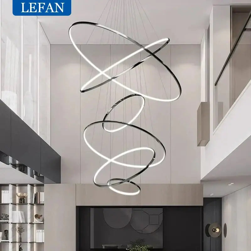 Modern chrome pendant light with interlocking rings and integrated led bulbs ideal for living room spaces of various square meters