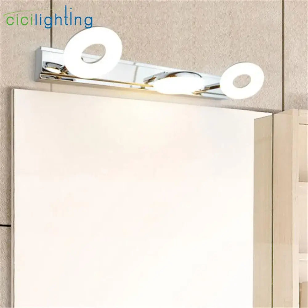 Modern chrome led vanity lamp with three circular led bulbs for bathroom mirror lighting in a sleek minimalist design