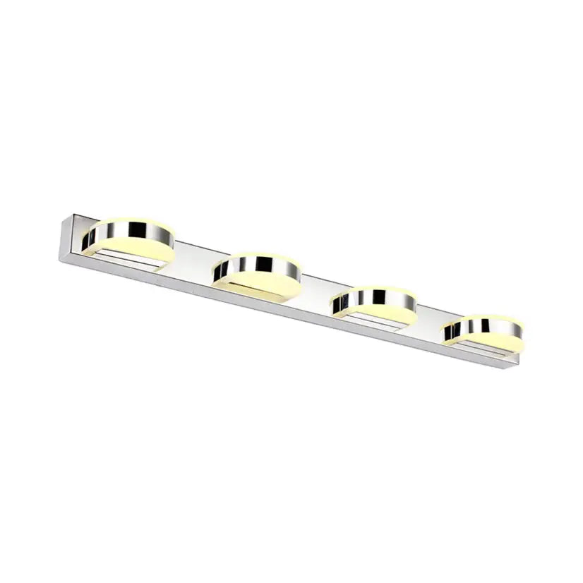 Modern chrome led vanity mirror light with four circular led bulbs emitting warm yellow glow for bathroom use