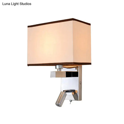 Modern chrome led wall sconce lighting with cream fabric shade and polished metal frame featuring adjustable reading spotlight