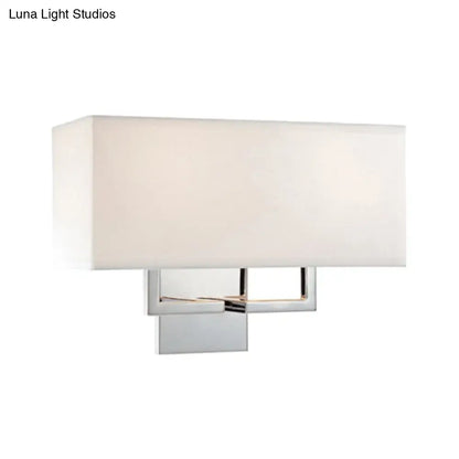 Modern chrome led wall sconce with a sleek chrome frame and soft white fabric shade for bedroom lighting