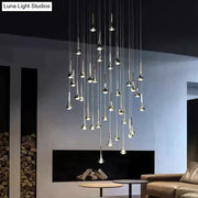 Modern chrome-finished led water drop chandelier with slender trumpet-shaped fixtures suspended at varying heights