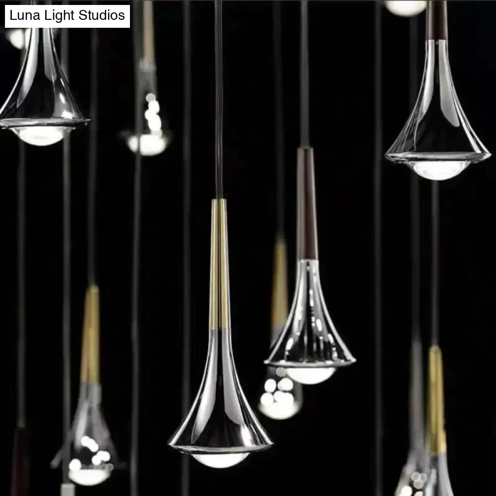 Modern glass led water drop chandelier with sleek chrome and brass accents in a contemporary decorbites lyra design