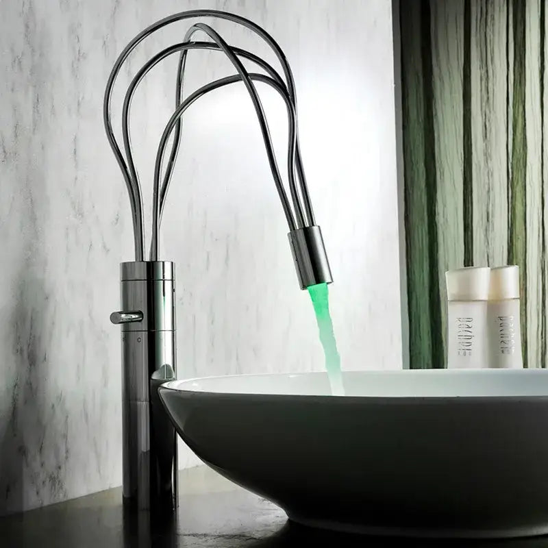 Modern chrome led waterfall bathroom faucet with sculptural multi-arched design and glowing green water flow decorbites led waterfall